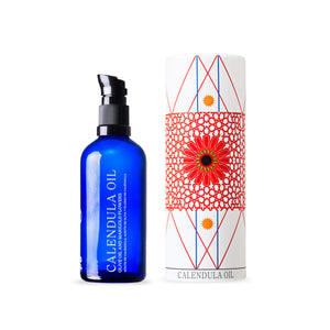 Andaluz Skincare Calendula Oil blue pump bottle and decorative circular box with Andalusian design